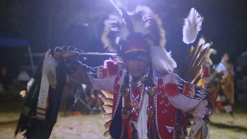 A man dancing at a powwow in a still from Sky Hopinka's "Powwow People."